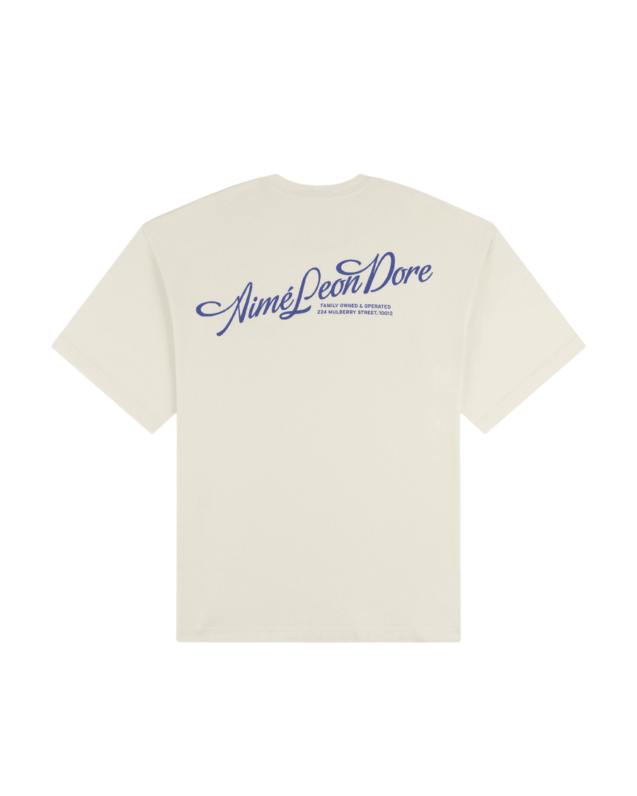 Camiseta Aimé Leon Dore Pappoús Logo Pristine Off White em white original na LK Sneakers