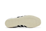 Vista traseira do Adidas adidas Japan White Black mostrando calcanheira e detalhes do solado