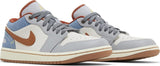 Vista frontal do Jordan Nike Air Jordan 1 Low Phantom Denim mostrando biqueira e costuras