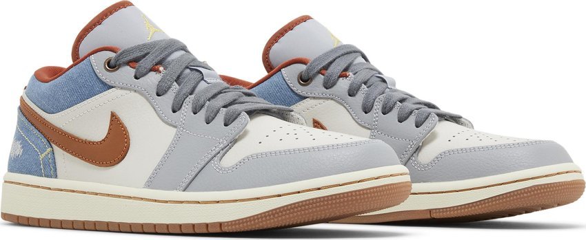 Vista frontal do Jordan Nike Air Jordan 1 Low Phantom Denim mostrando biqueira e costuras