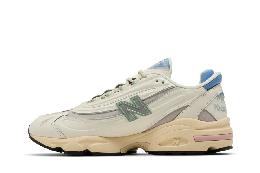 Vista lateral do New Balance New Balance 1000 Angora Moonrock mostrando design do cabedal e logo da marca