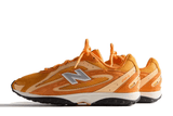 Vista superior do New Balance New Balance 204L Kith Orange mostrando abertura, lingueta e cadarços