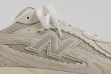 Vista frontal do New Balance New Balance 204L Sea Salt Linen mostrando biqueira e costuras