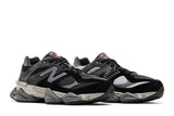 Vista frontal do New Balance New Balance 9060 Black Castlerock Grey mostrando biqueira e costuras