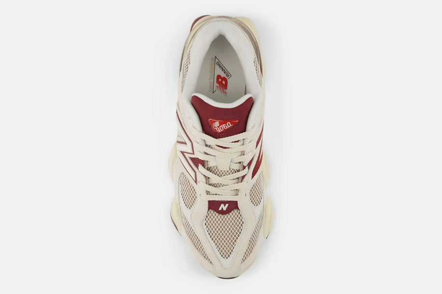 Vista frontal do New Balance New Balance 9060 'Linen Burgundy' mostrando biqueira e costuras