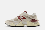 Vista lateral do New Balance New Balance 9060 'Linen Burgundy' mostrando design do cabedal e logo da marca