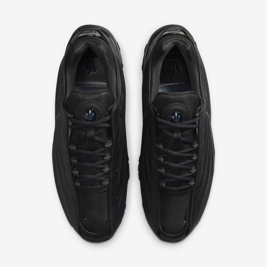Vista traseira do Nike Nike Hot Step 2 x NOCTA Black mostrando calcanheira e detalhes do solado