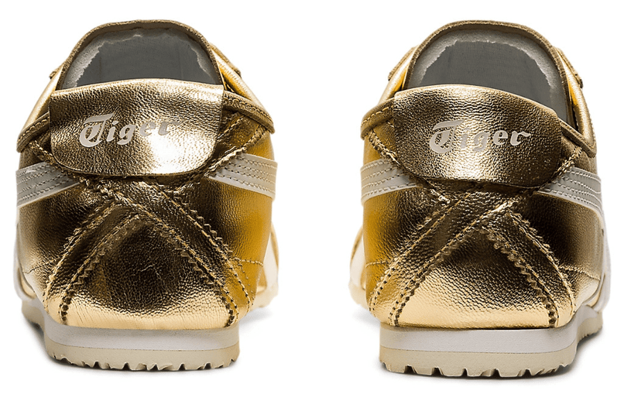 Vista traseira do Onitsuka Tiger Onitsuka Tiger Mexico 66 Gold White Dourado mostrando calcanheira e detalhes do solado