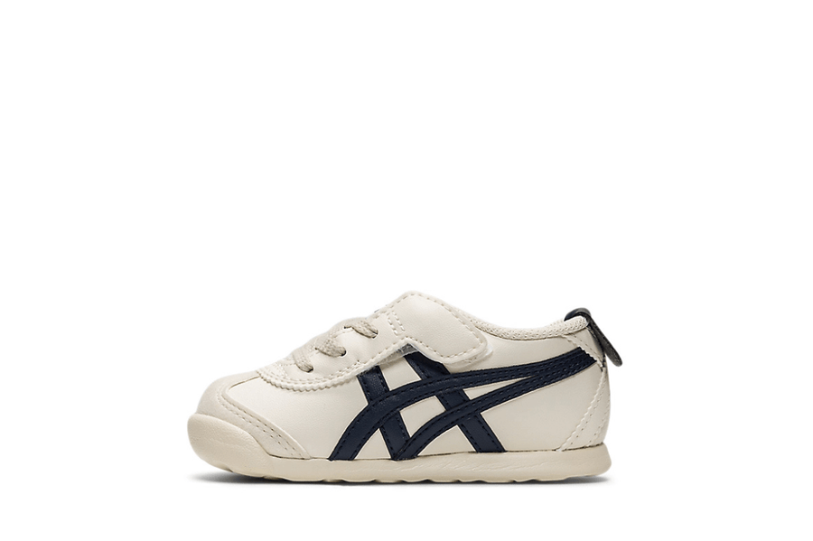 Vista lateral do Onitsuka Tiger Onitsuka Tiger Mexico 66 Kids Birch/Peacoat mostrando design do cabedal e logo da marca