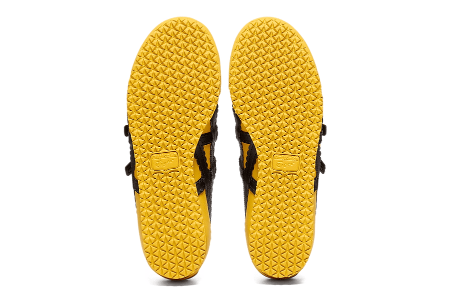 Vista do solado do Onitsuka Tiger Onitsuka Tiger Mexico 66 TGRS Yellow/Black mostrando padrão de tração e tecnologia de amortecimento