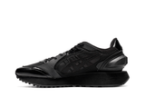 Vista lateral do Onitsuka Tiger Onitsuka Tiger Moage Black/Graphite Grey mostrando design do cabedal e logo da marca