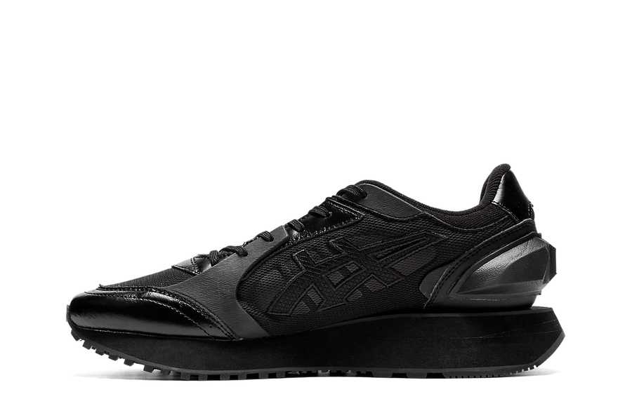 Vista lateral do Onitsuka Tiger Onitsuka Tiger Moage Black/Graphite Grey mostrando design do cabedal e logo da marca