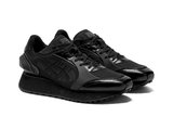 Vista traseira do Onitsuka Tiger Onitsuka Tiger Moage Black/Graphite Grey mostrando calcanheira e detalhes do solado