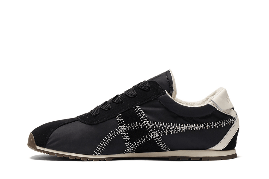 Vista lateral do Onitsuka Tiger Onitsuka Tiger Tiger Corsair A55 Black Cream mostrando design do cabedal e logo da marca