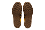 Vista em detalhe do Onitsuka Tiger Onitsuka Tiger Tsunahiki Slip-On Sunflower Yellow/Black mostrando textura do material e acabamento