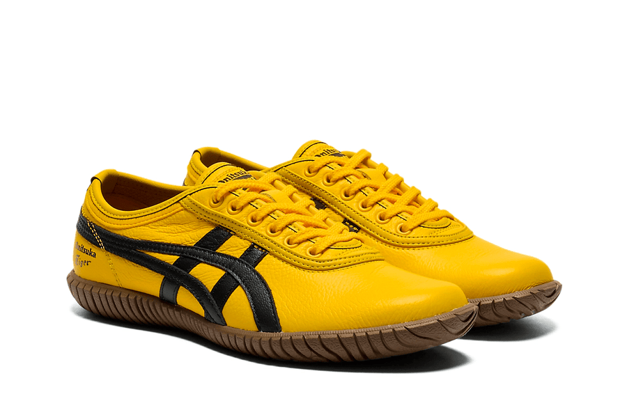 Vista na caixa do Onitsuka Tiger Onitsuka Tiger Tsunahiki Slip-On Sunflower Yellow/Black mostrando embalagem original da marca