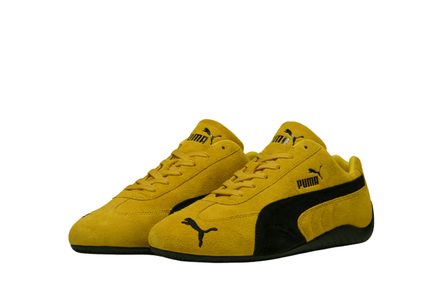 Vista traseira do Puma Puma Speedcat OG Pelé Yellow Black mostrando calcanheira e detalhes do solado