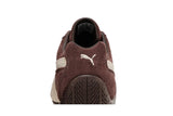 Vista do solado do Puma Puma Speedcat TTF 'Dark Chocolate Frosted Ivory' mostrando padrão de tração e tecnologia de amortecimento