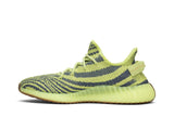 Vista lateral do Yeezy Adidas Yeezy Boost 350 V2 Semi Frozen Yellow mostrando design do cabedal e logo da marca