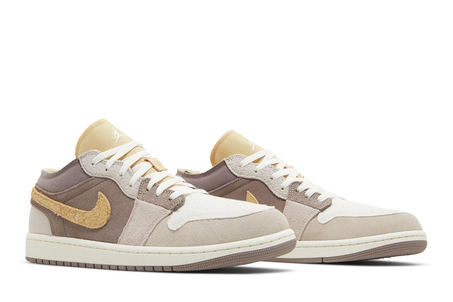 Vista frontal do Jordan Nike Air Jordan 1 Low SE Craft Inside Out Taupe Haze mostrando biqueira e costuras