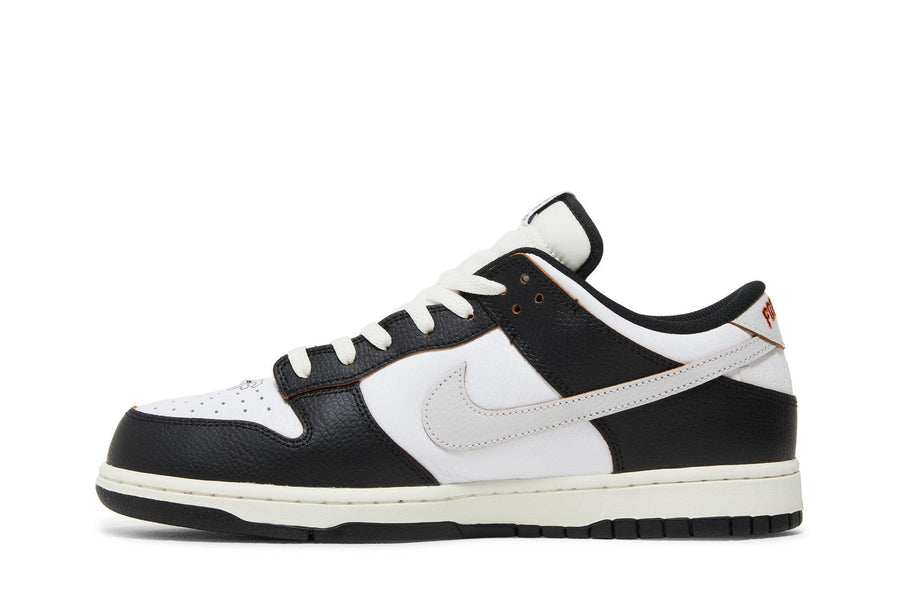 Vista lateral do Nike HUF x Nike SB Dunk Low San Francisco mostrando design do cabedal e logo da marca