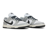 Vista frontal do Nike Nike Dunk Low Light Smoke Grey mostrando biqueira e costuras