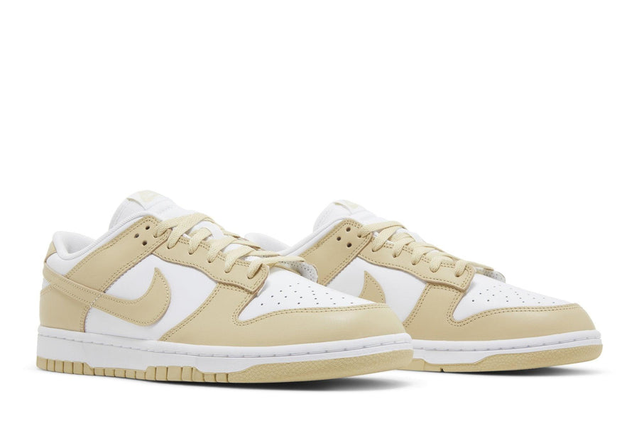 Vista frontal do Nike Nike Dunk Low Team Gold Dourado mostrando biqueira e costuras